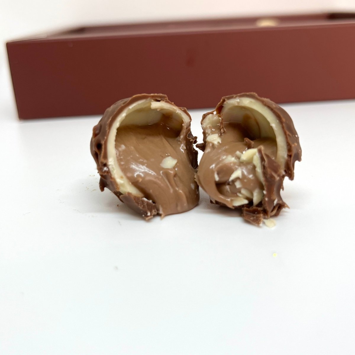 Ema Chocolate Milk and White Chocolate Truffles With Hazelnut Cream - 250g - TryAladdin